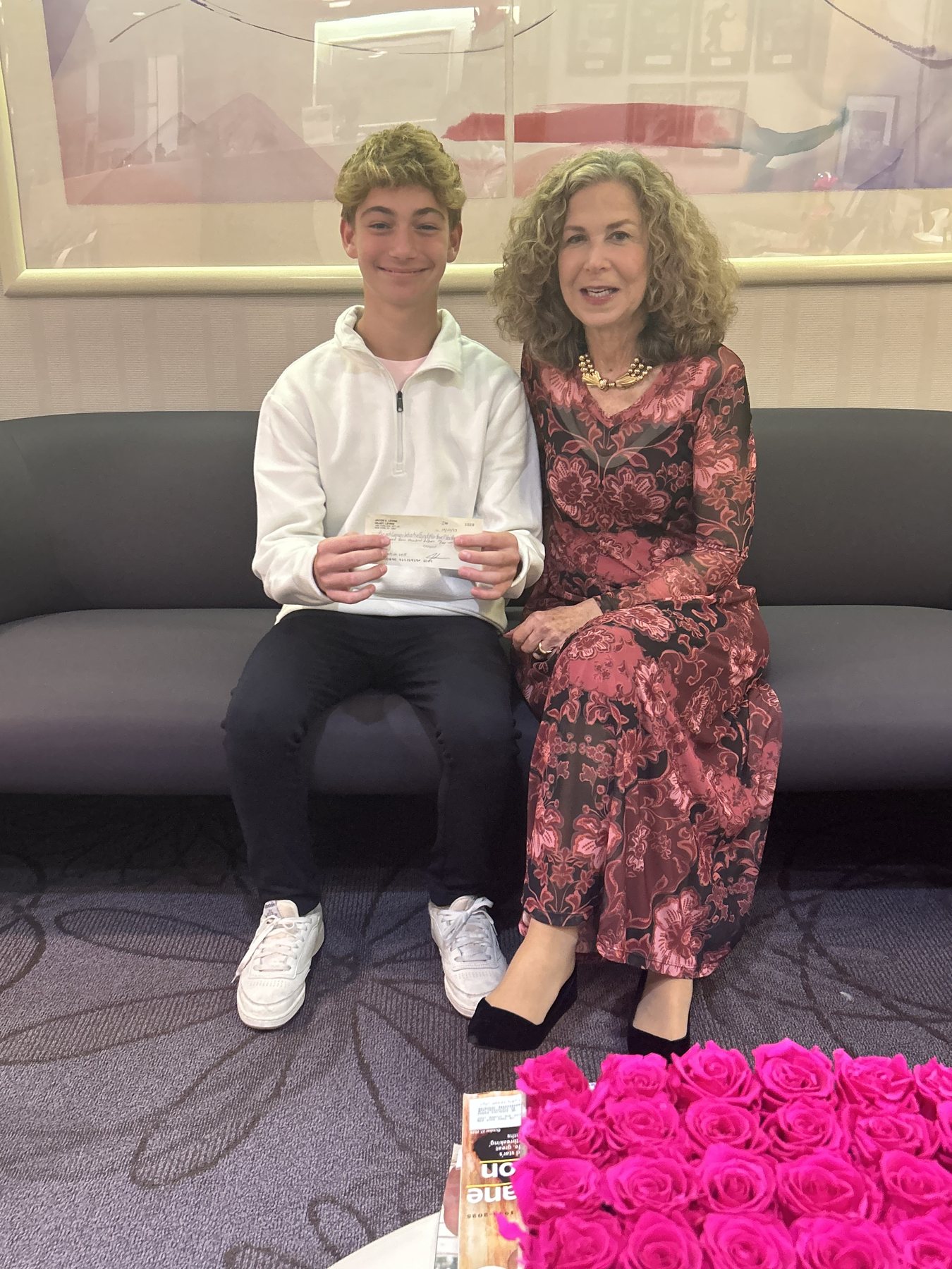 Max presenting a fundraising check
